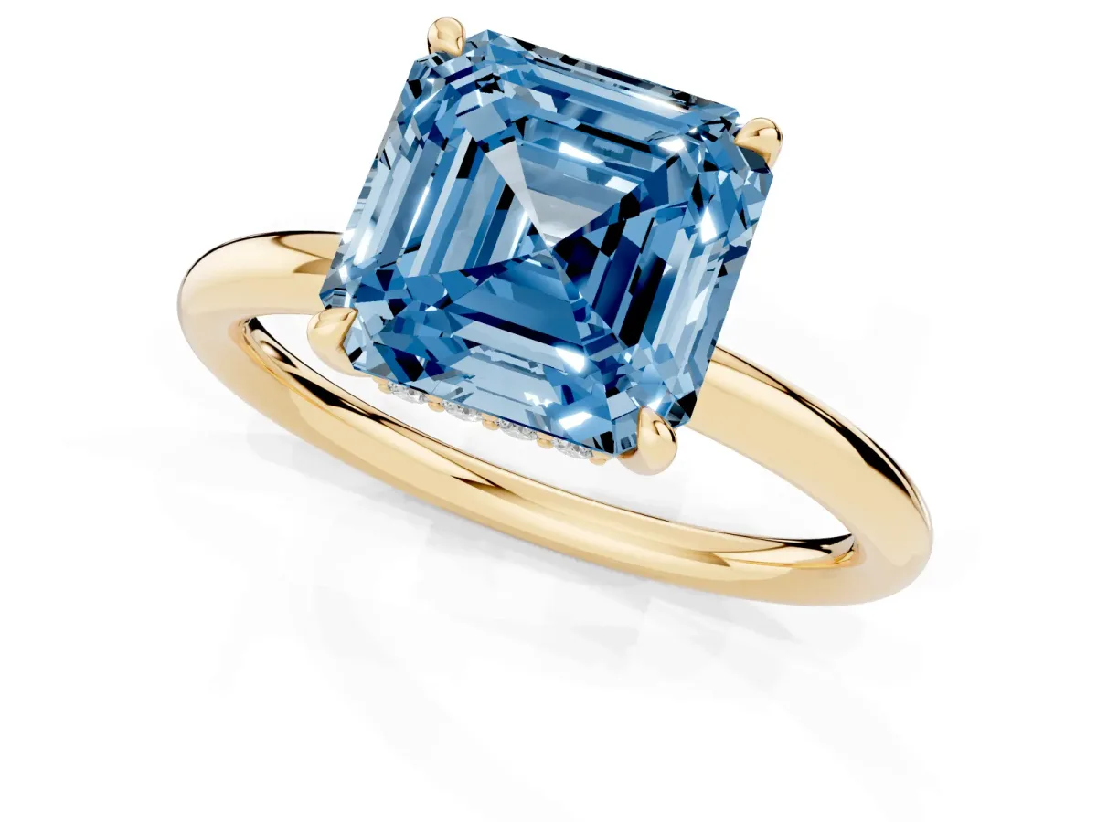 Fancy Blue Asscher Cut Diamond Solitaire Ring with Thin Band and Four-Prong Setting Yellow gold