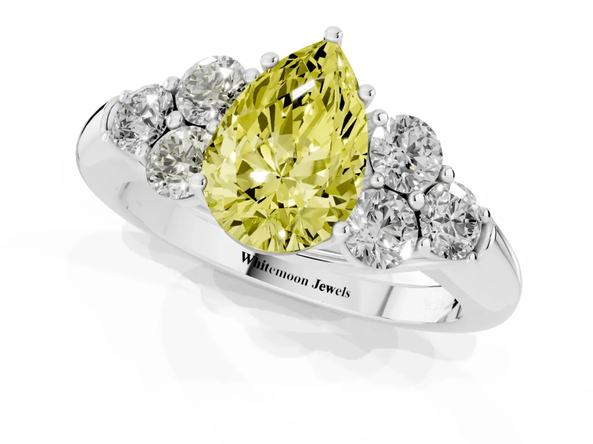 Fancy Yellow Pear Cut Cut Diamond Cluster Ring with Round Accent Stones and Prong Setting on a Classic Band Silver