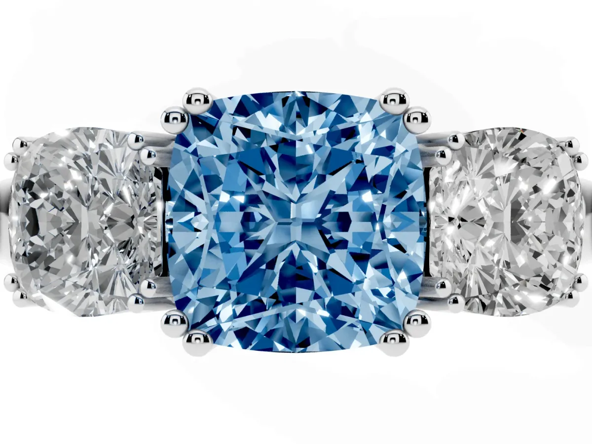 Fancy Blue Three-Stone Cushion Cut Cut Diamond Ring with Channel Set Band and Four-Prong Setting Platinum
