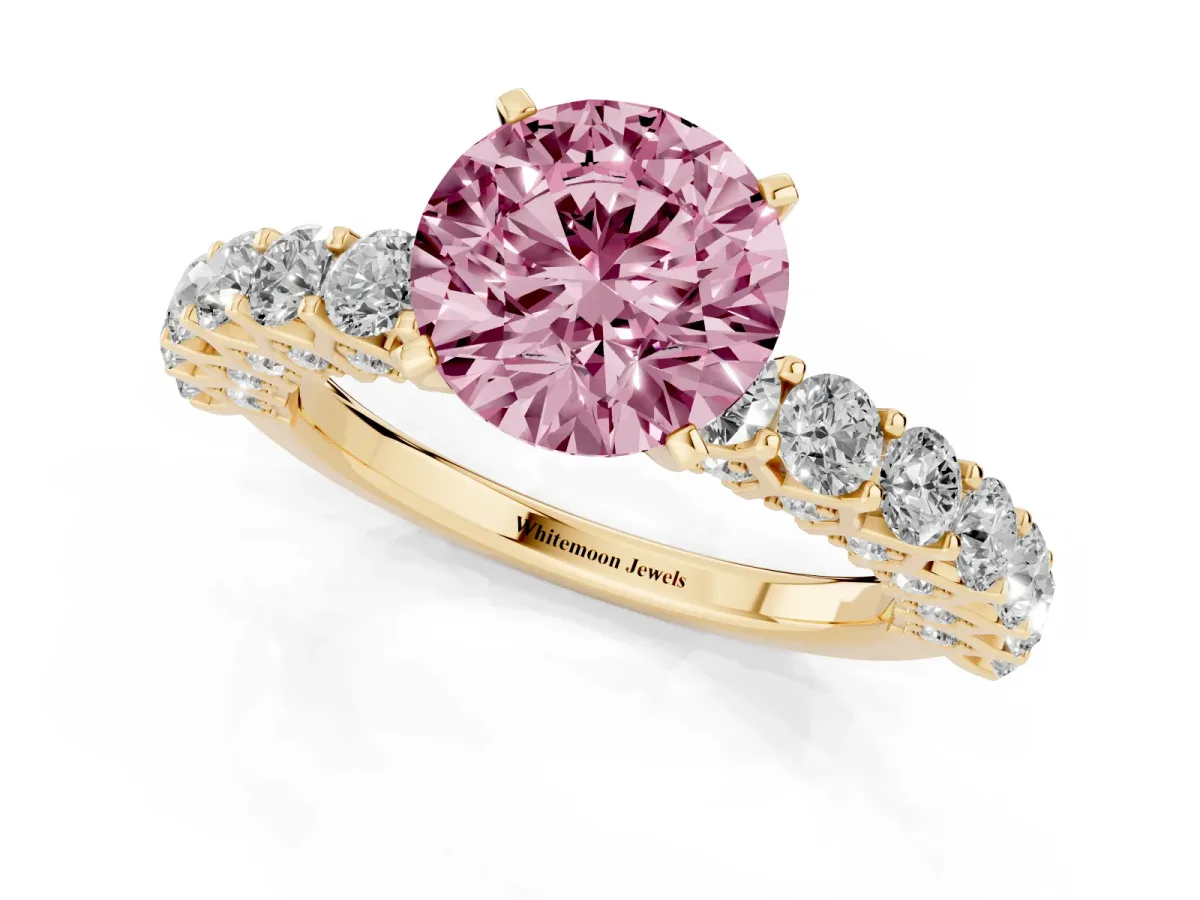 Fancy Pink Round Cut Diamond Solitaire Ring with Shared Prong Pavé Band and Four-Prong Setting Yellow gold