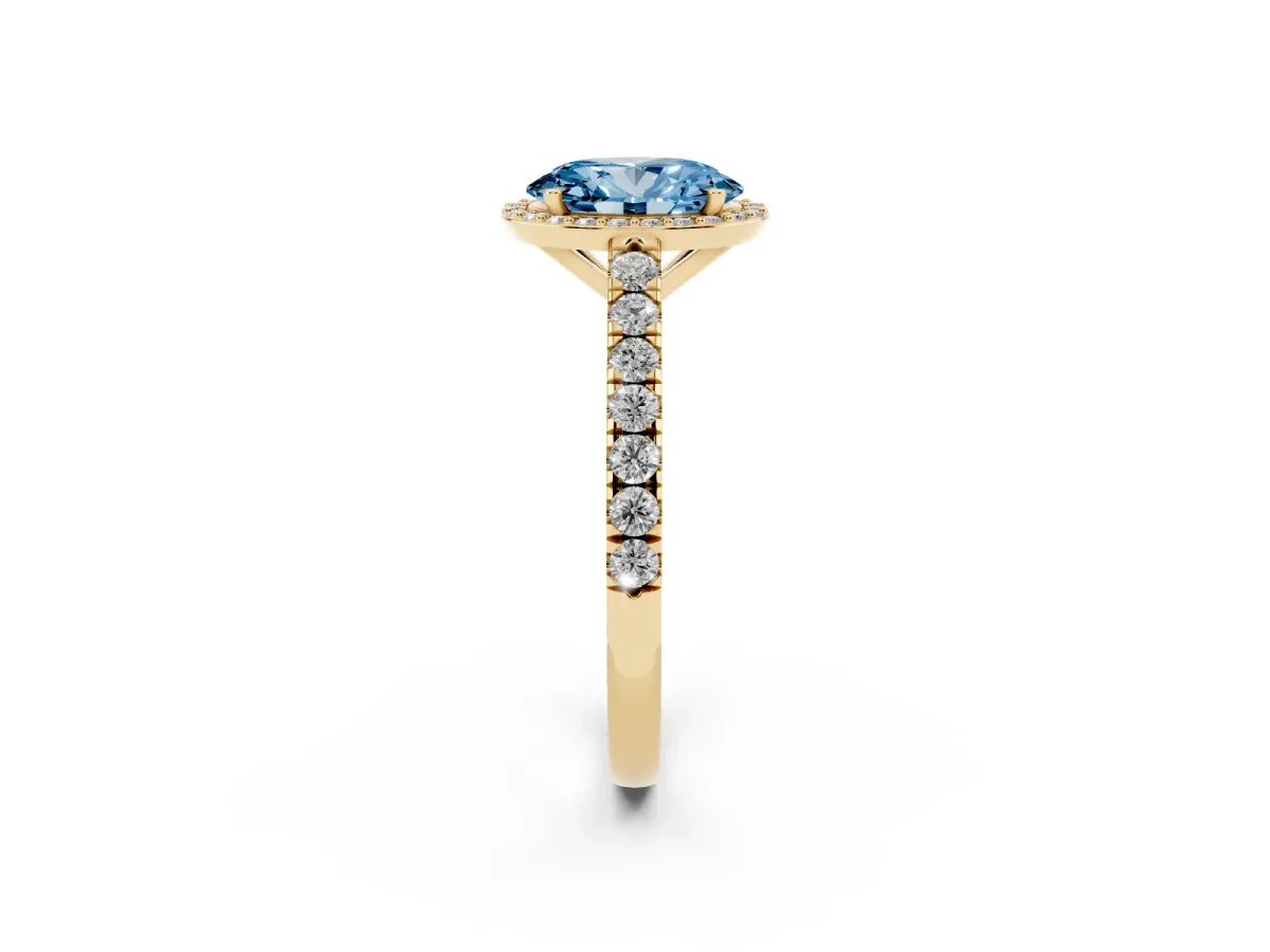 Fancy Blue Oval Cut Cut Halo Diamond Engagement Ring with Pave Band and Four-Prong Setting Yellow gold