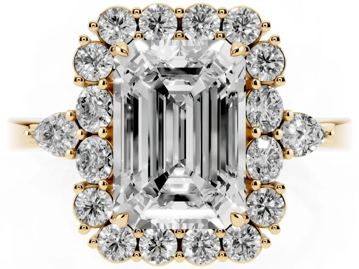 Emerald Cut Diamond Halo Ring with Pear Side Stones and Prong Setting Yellow gold