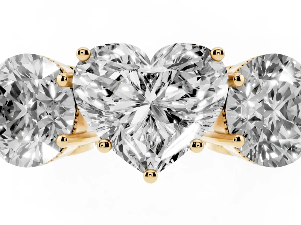 Three-Stone Heart Cut Diamond Engagement Ring with Prong Setting on a Classic Band Yellow gold