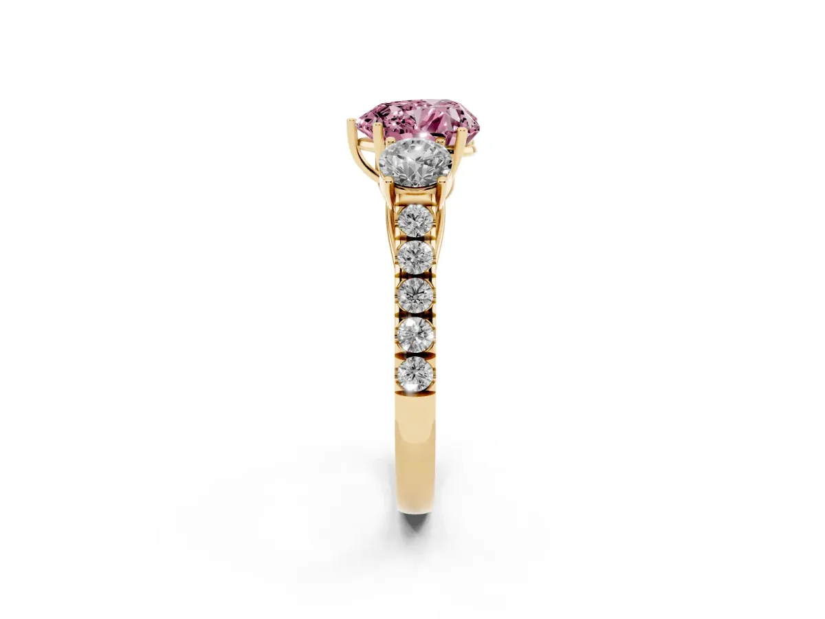 Fancy Pink Heart Cut Cut Diamond Three-Stone Ring with Round Side Stones and Pavé Band Yellow gold