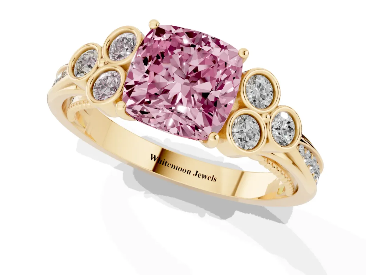 Fancy Pink Cushion Cut Cut Diamond Engagement Ring with Bezel Set Round Side Stones and Prong Setting Yellow gold