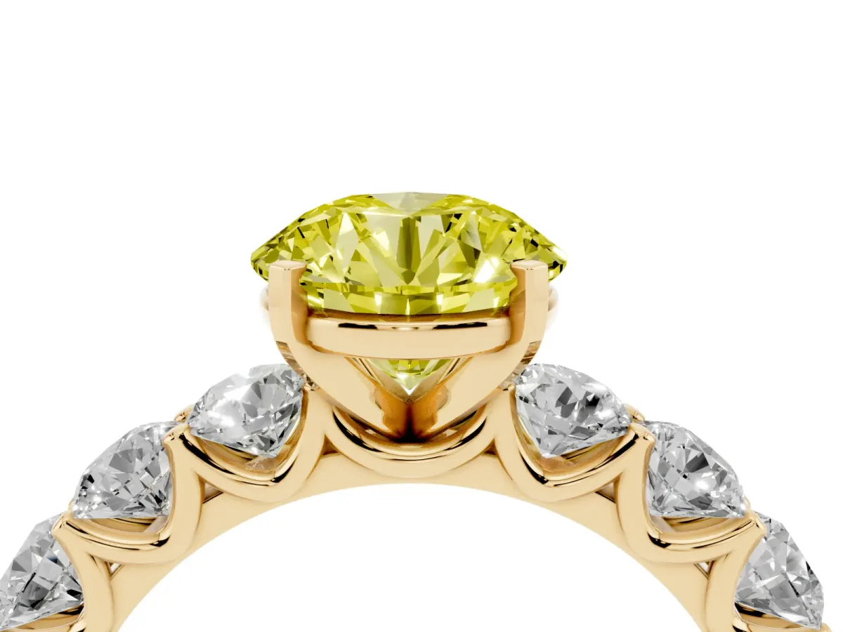 Fancy Yellow Round Cut Diamond Prong Setting with Side Stones on a Pave Band Yellow gold