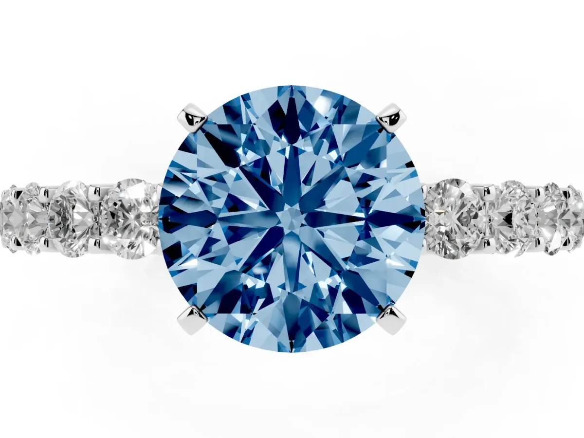 Fancy Blue Round Cut Diamond Solitaire Ring with Shared Prong Pavé Band and Four-Prong Setting Silver