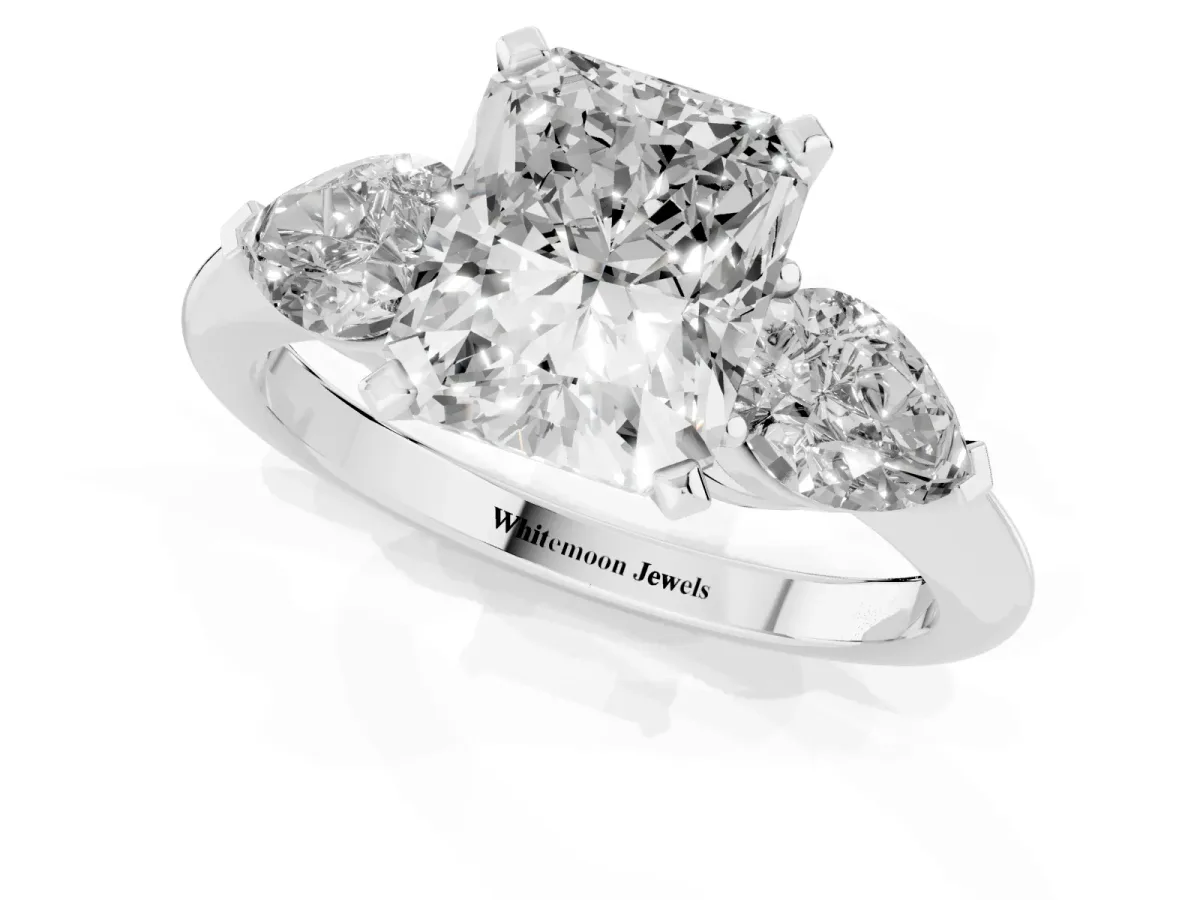 Three-Stone Radiant Cut Diamond Ring with Pear Side Stones and Four-Prong Setting Platinum