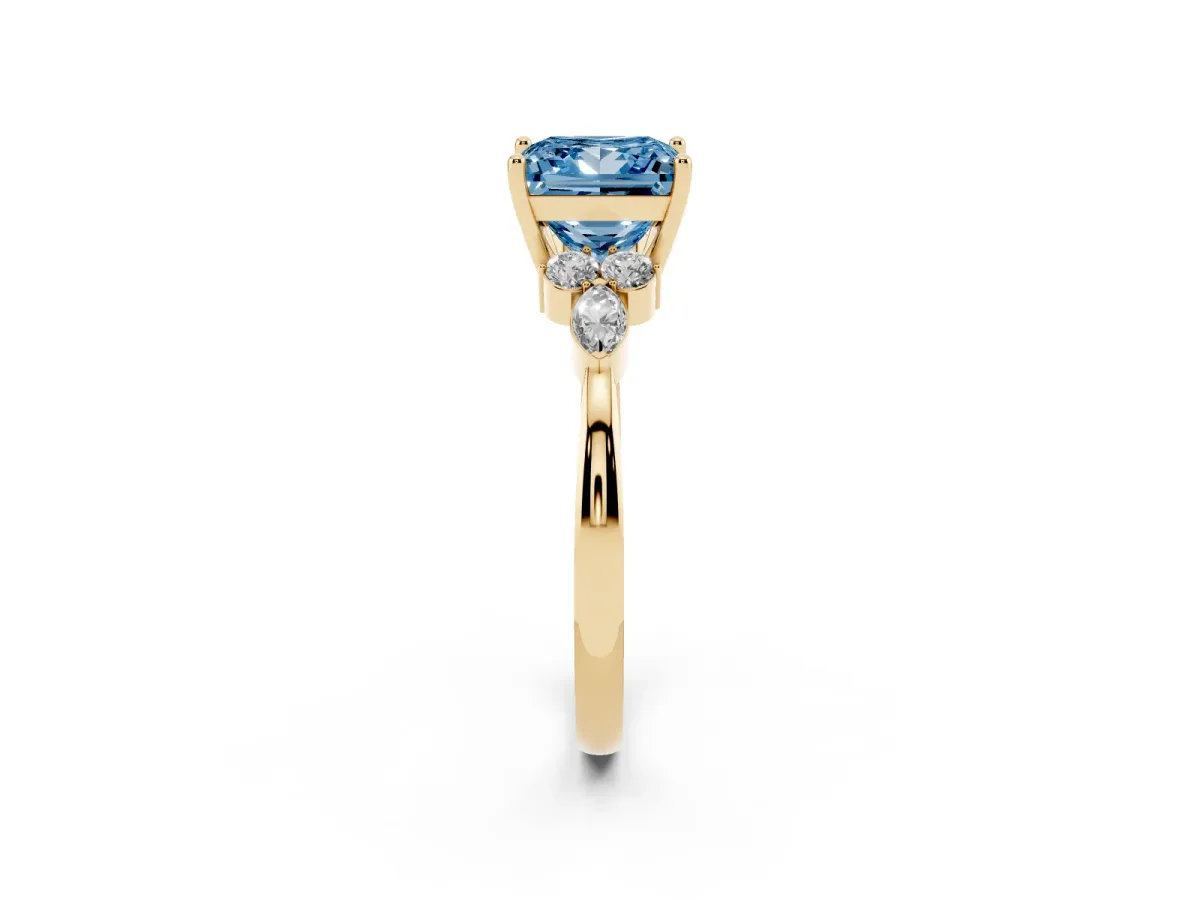Fancy Blue Princess Cut Brilliant Diamond Solitaire Ring with Pear Side Stones and Four-Prong Setting Yellow gold