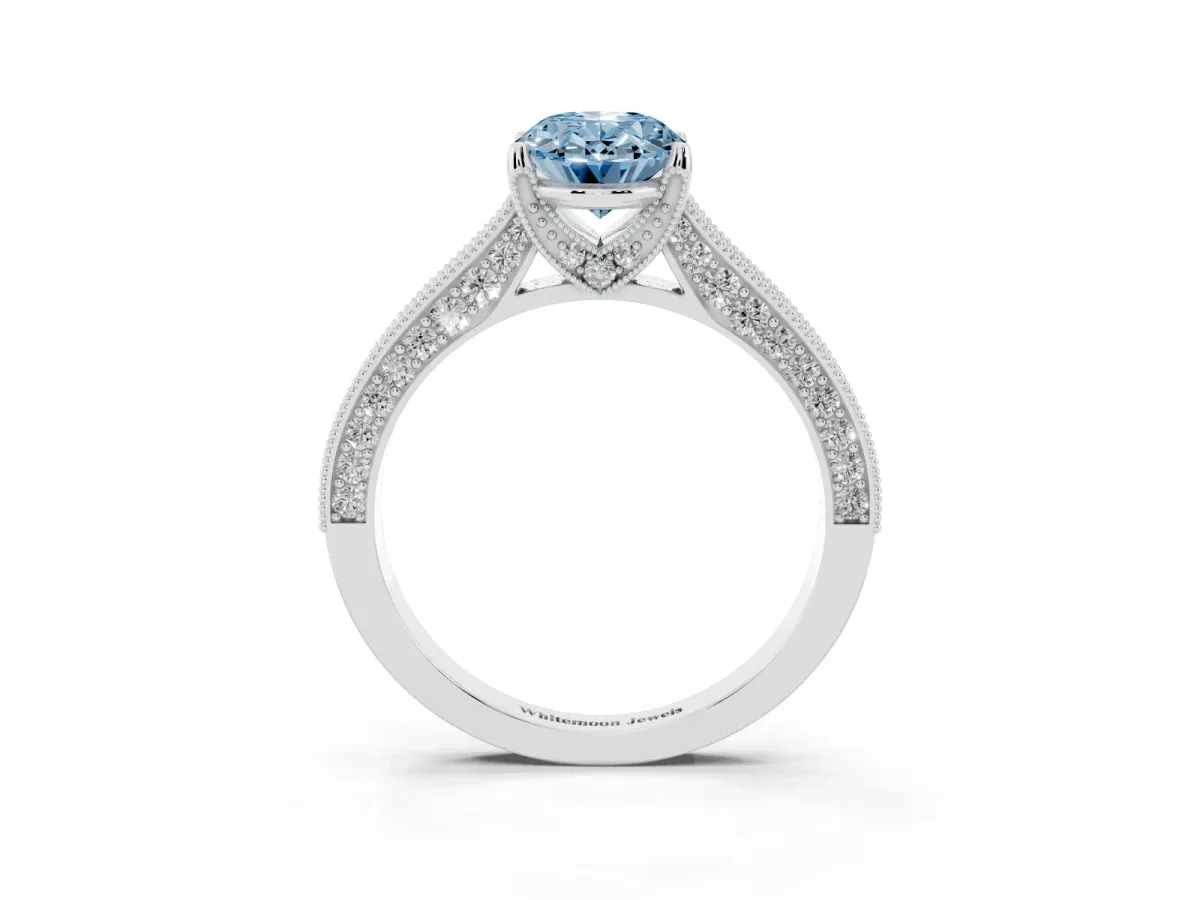 Fancy Blue Oval Cut Cut Diamond Solitaire Ring with Milgrain Pave Band and Four Prong Setting Silver