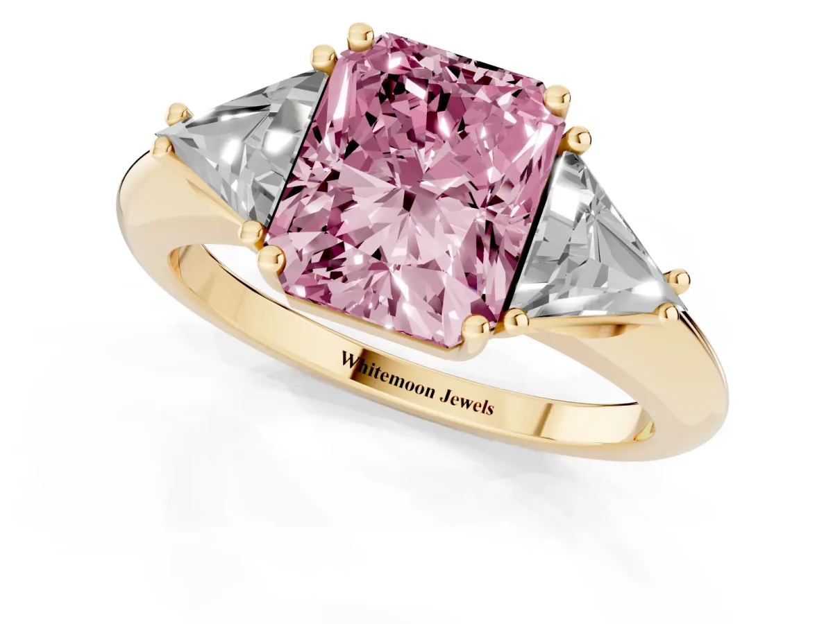 Fancy Pink Three-Stone Radiant Cut Diamond Engagement Ring with Trillion Side Stones and Prong Setting Yellow gold