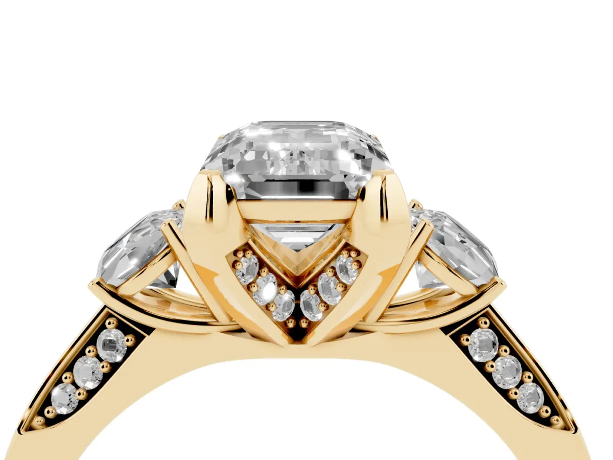 Emerald Cut Brilliant Three-Stone Diamond Ring with Pavé Band and Four-Prong Setting Yellow gold