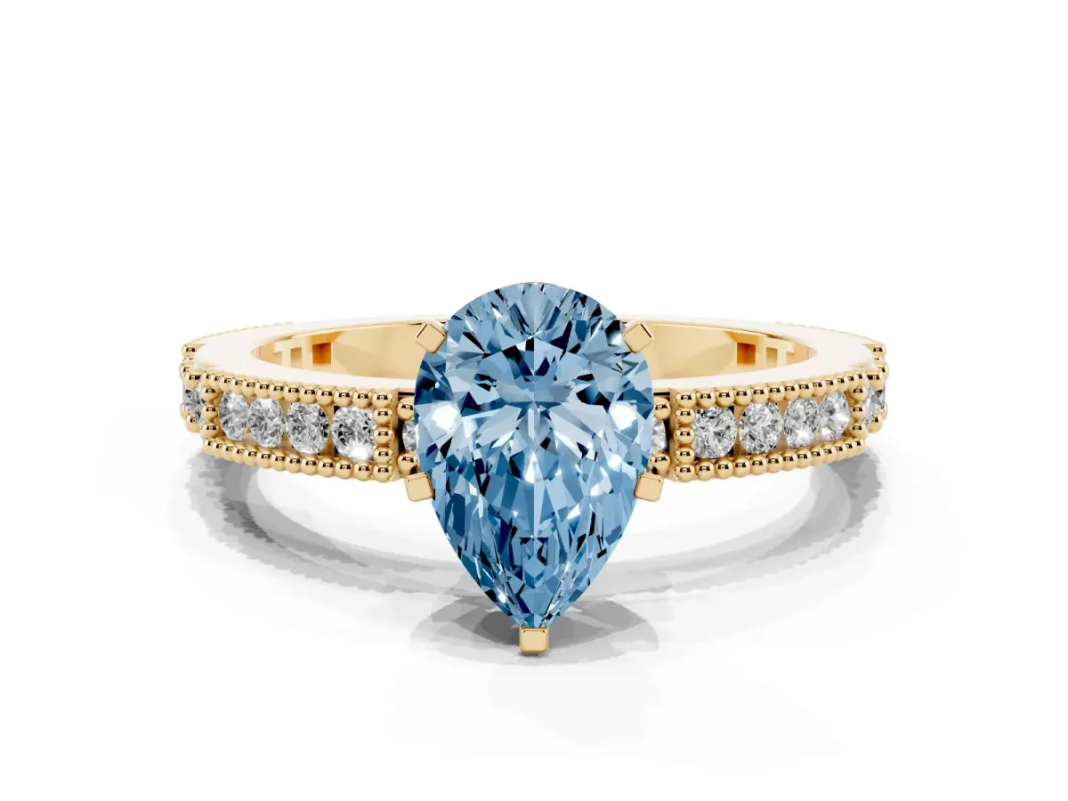 Fancy Blue Pear Cut Solitaire with Pavé Band and Four-Prong Setting Yellow gold