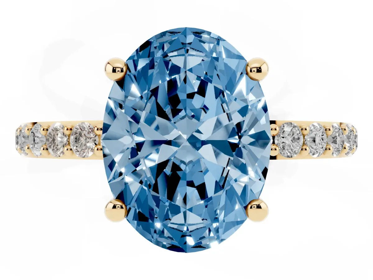 Fancy Blue Oval Cut Diamond Solitaire Ring with Round Pavé Band and Prong Setting Yellow gold