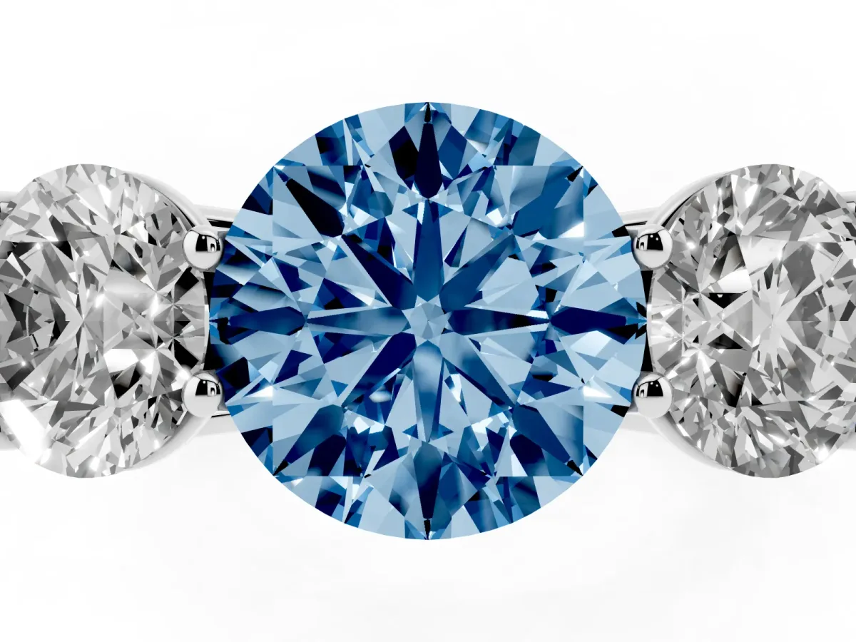 Fancy Blue Round Cut Three-Stone Diamond Ring with Prong Setting on a Classic Band Silver
