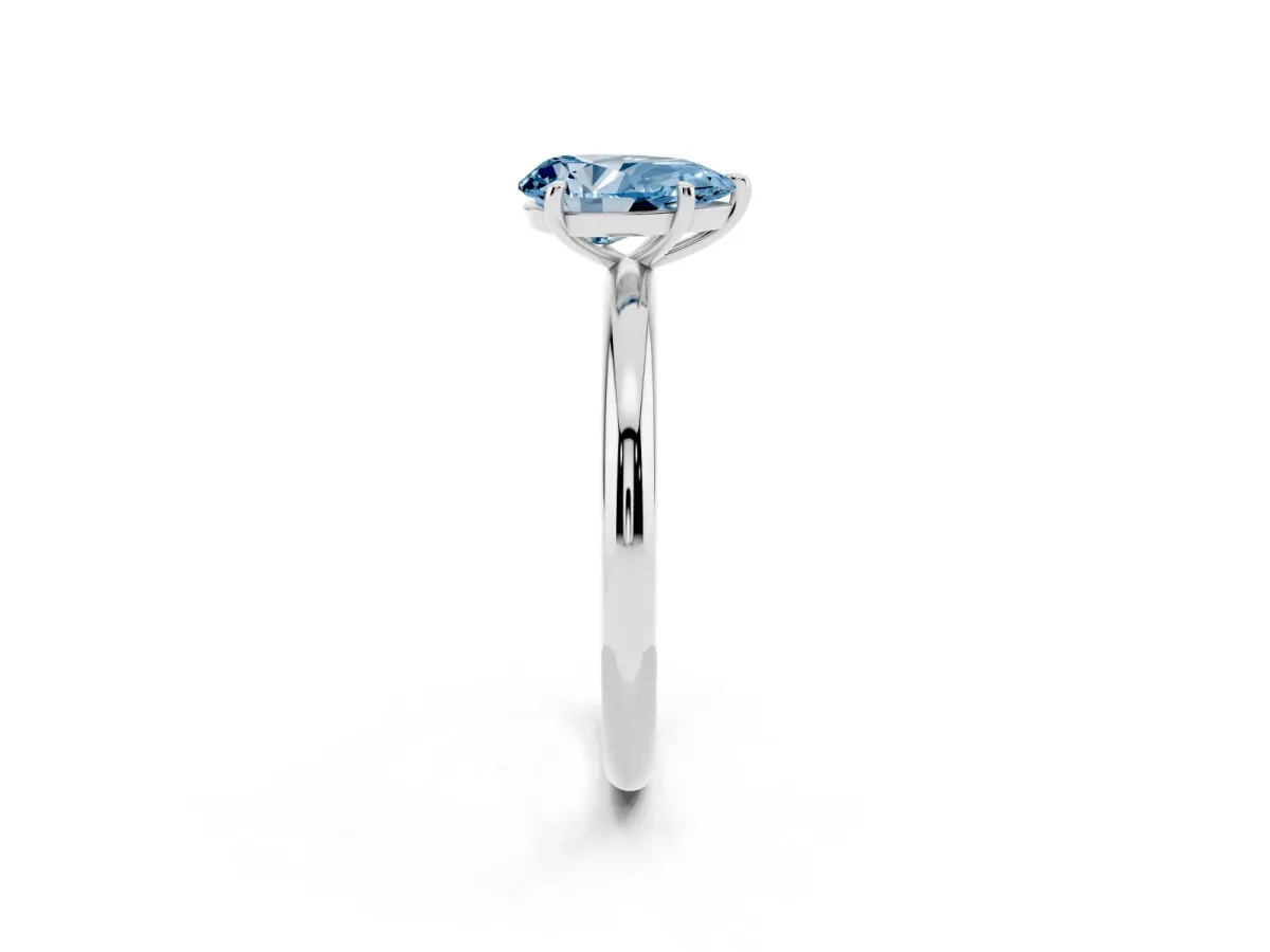 Fancy Blue Pear Cut Solitaire Diamond Ring with Four-Prong Setting on a Plain Band Silver