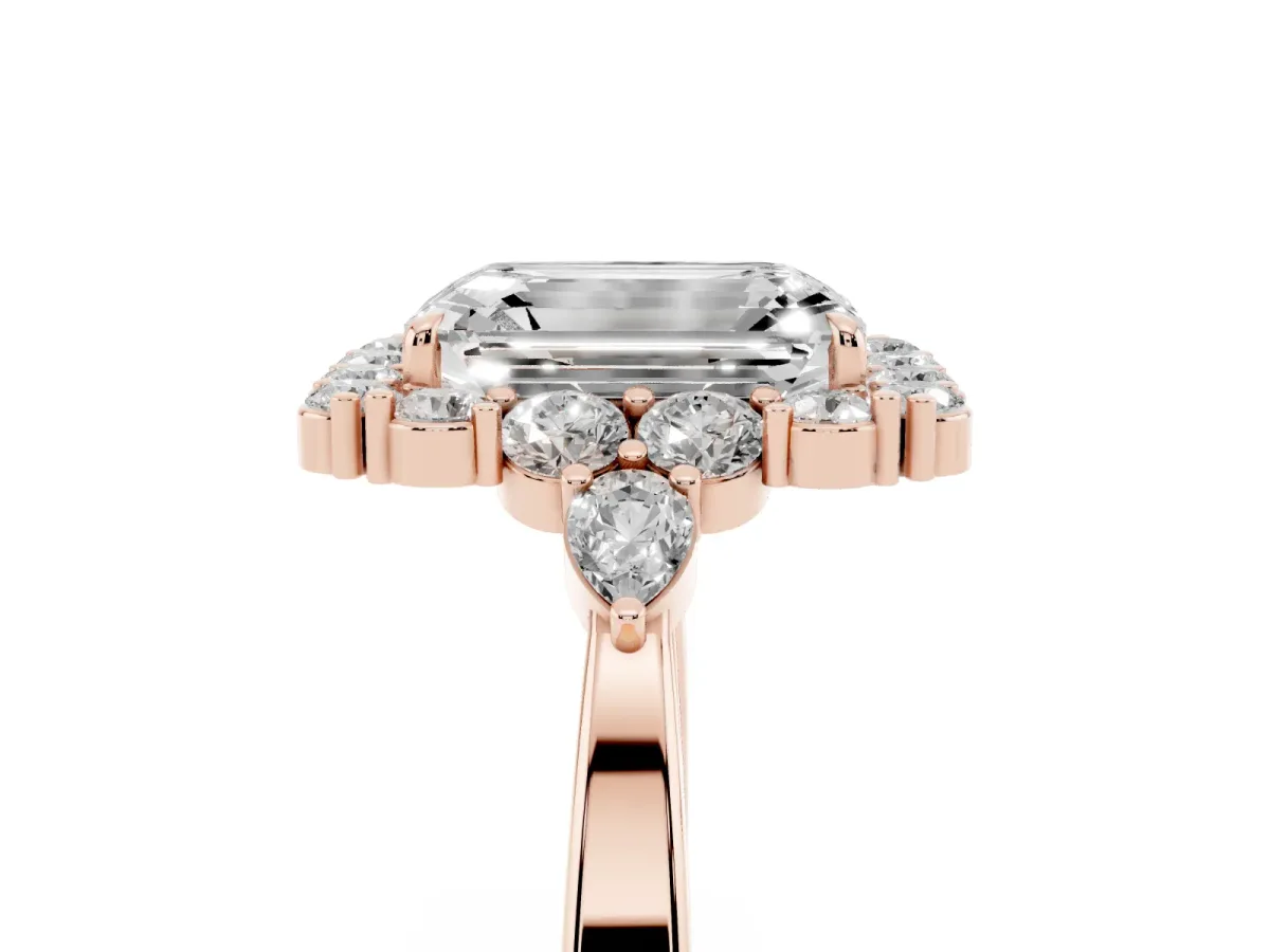 Emerald Cut Diamond Halo Ring with Pear Side Stones and Prong Setting Rose gold