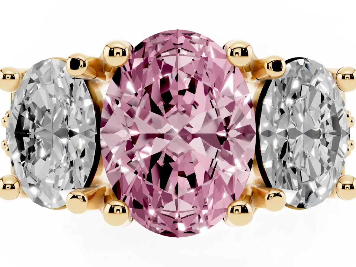 Fancy Pink Oval Cut Diamond Three-Stone Ring with Channel Set Band and Four-Prong Setting Yellow gold