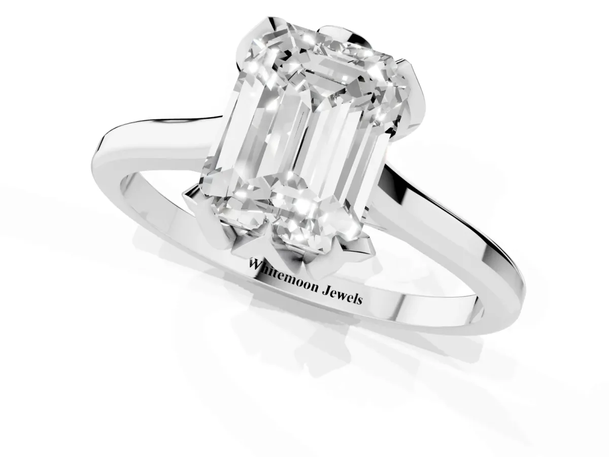 Emerald Cut Diamond Solitaire Ring with Flower Prong Setting and Classic Band Platinum