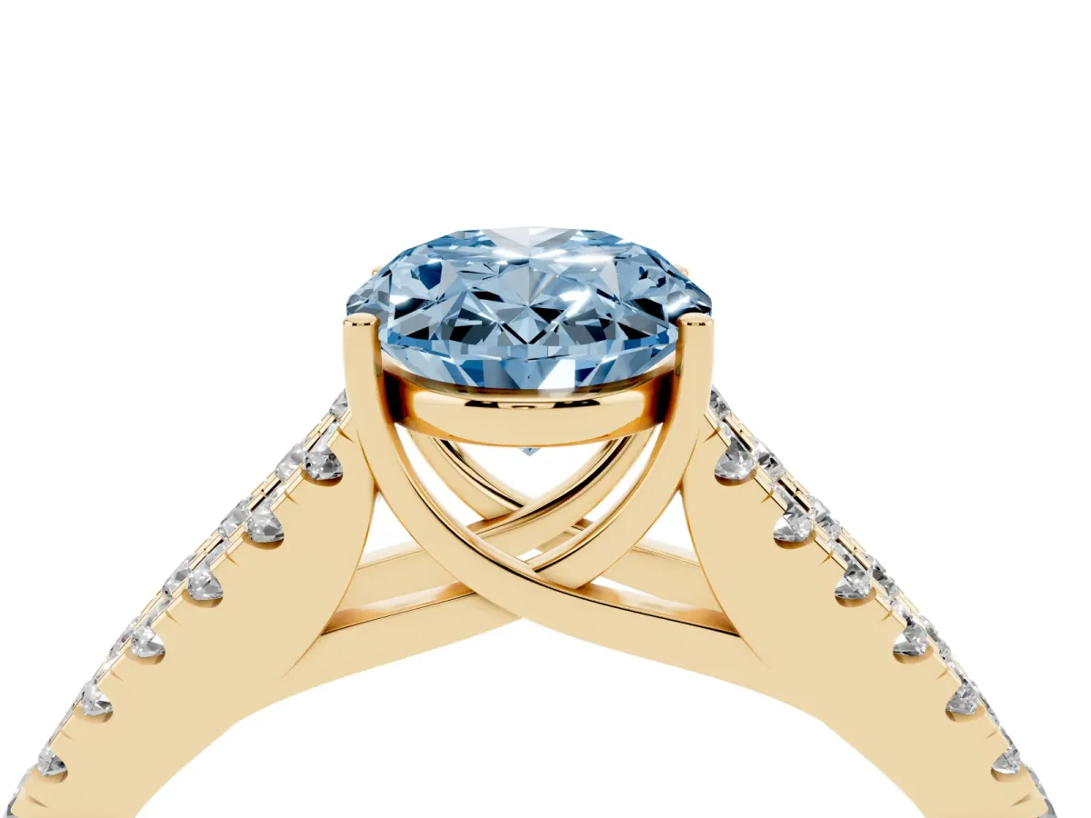 Fancy Blue Oval Cut Diamond Split Shank Pavé Engagement Ring with Four-Prong Setting Yellow gold