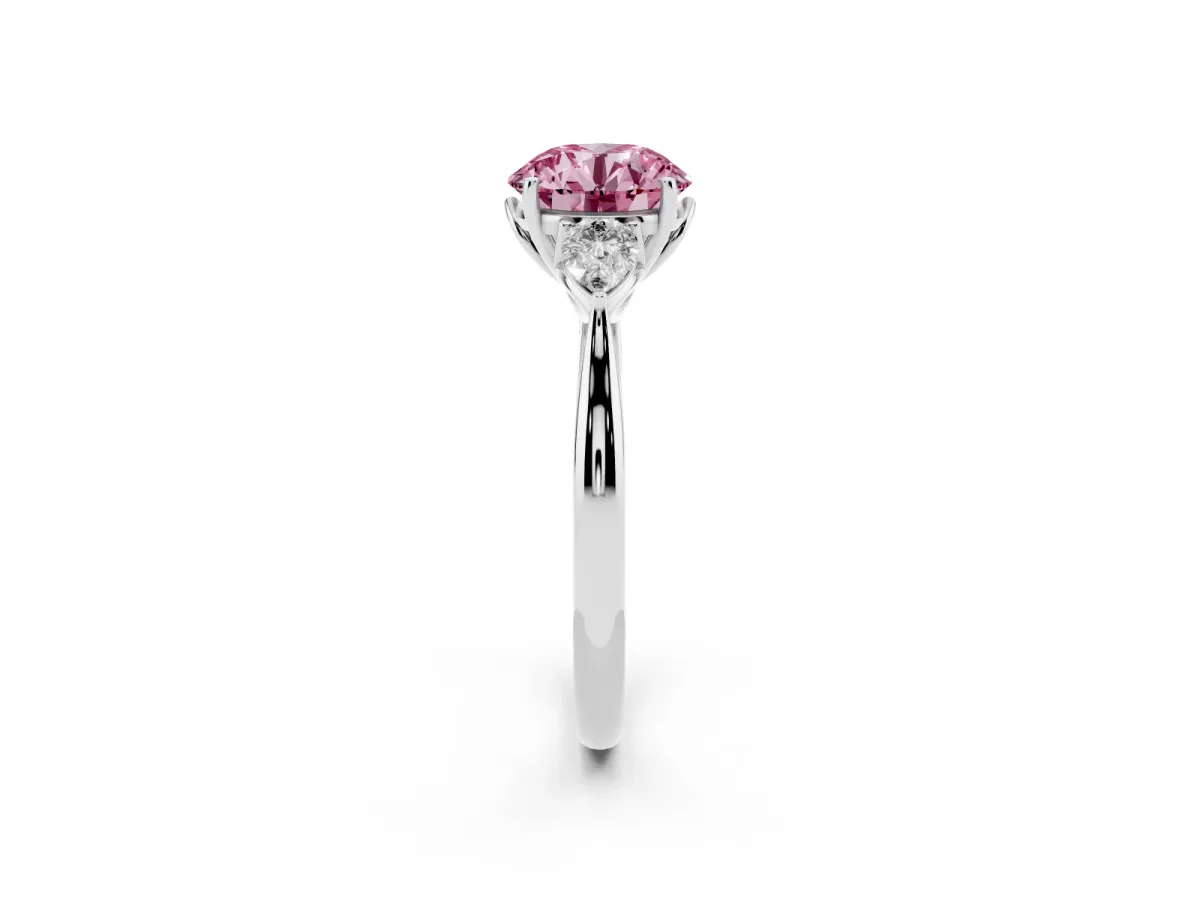 Fancy Pink Three-Stone Round Cut Brilliant Diamond Solitaire Ring with Tapered Band and Four-Prong Setting Silver