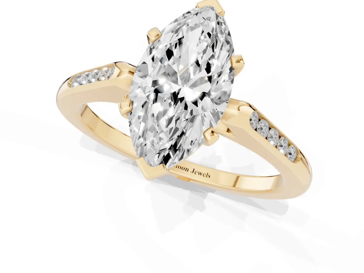 Marquise Cut Diamond Solitaire Ring with Channel Set Round Band and Prong Setting Yellow gold