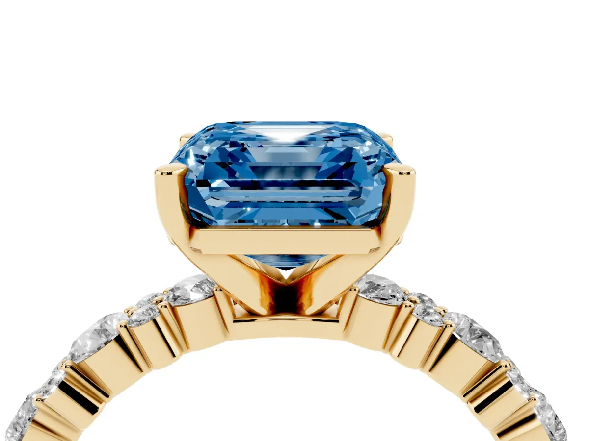 Fancy Blue Asscher Cut Diamond Side Stone Solitaire Ring with Round and Four-Prong Setting Yellow gold