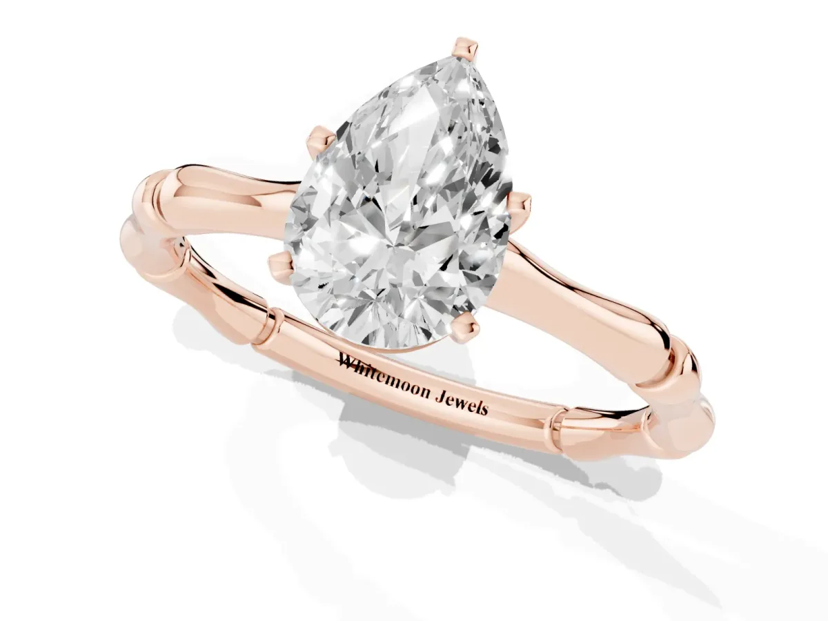 Pear Cut Solitaire Diamond Ring with Bamboo Band and Four-Prong Setting Rose gold