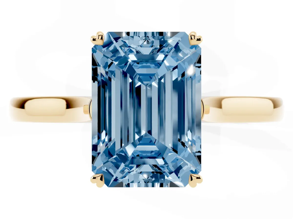 Fancy Blue Emerald Cut Solitaire Heart Prong Engagement Ring with Tapered Band Yellow gold