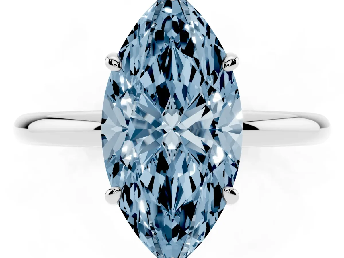 Fancy Blue Oval Cut Solitaire Diamond Ring with Four-Prong Setting on a Plain Band Platinum