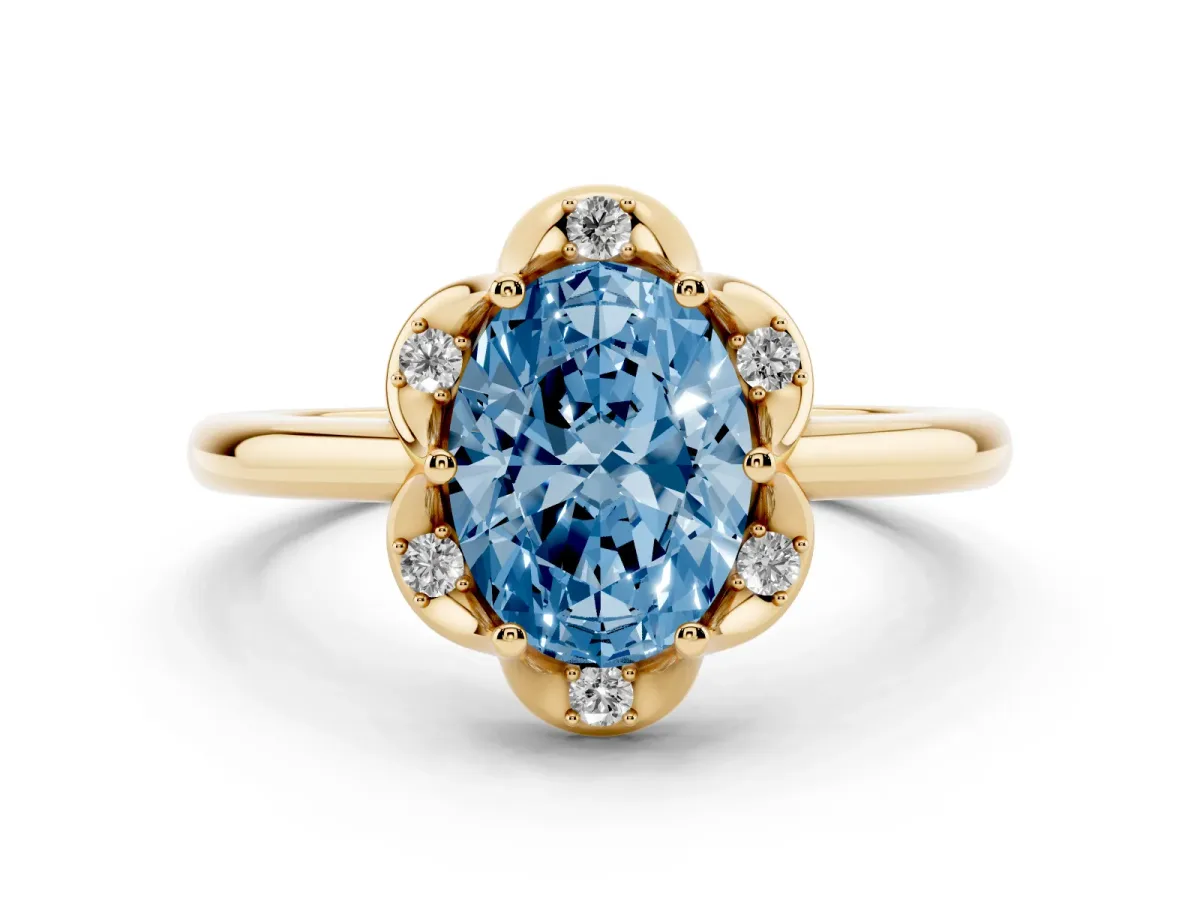 Fancy Blue Oval Cut Halo Diamond Ring with Round Cluster Setting, Solitaire Band, and Four-Prong Setting Yellow gold
