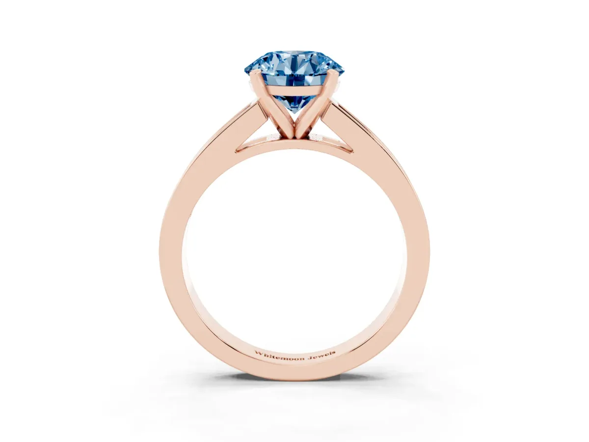 Fancy Blue Round Cut Solitaire Diamond Ring with Channel-Set Band and Four-Prong Setting Rose gold