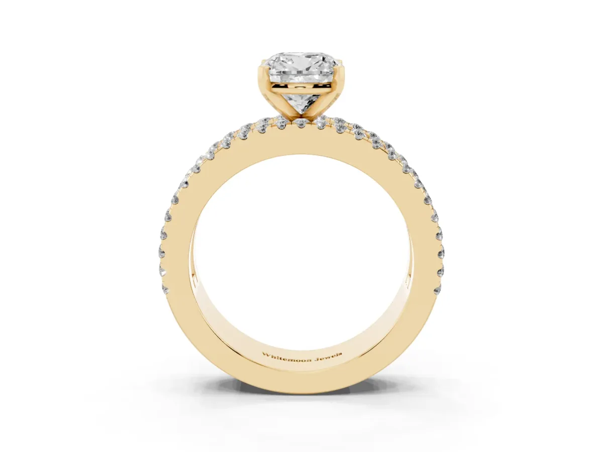 Cushion Cut Diamond Solitaire Ring with Pavé and Channel Set Band Yellow gold