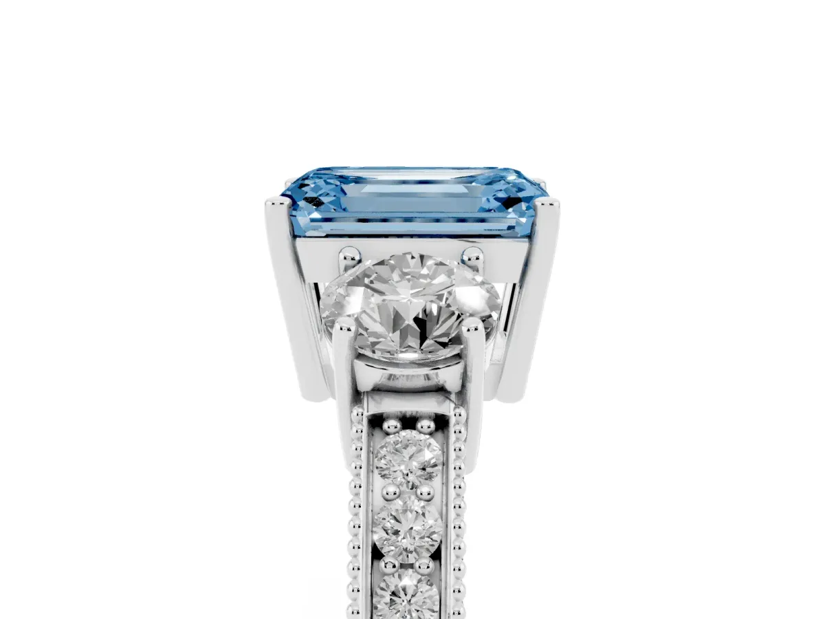 Fancy Blue Emerald Cut Three-Stone Diamond Ring with Pavé Band and Four-Prong Setting Silver