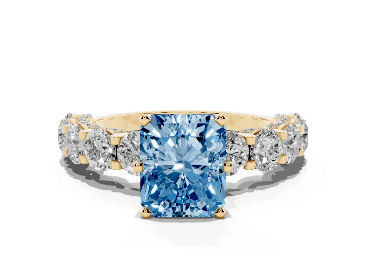 Fancy Blue Radiant Cut Diamond Side Stone Engagement Ring with Four-Prong Setting Yellow gold