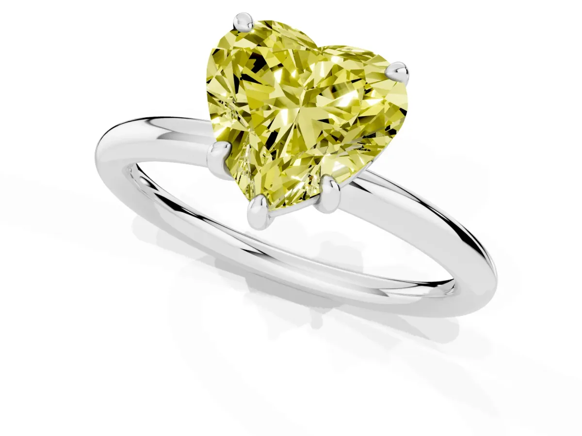 Fancy Yellow Heart Cut Solitaire Diamond Ring with Four-Prong Setting on a Plain Band Platinum