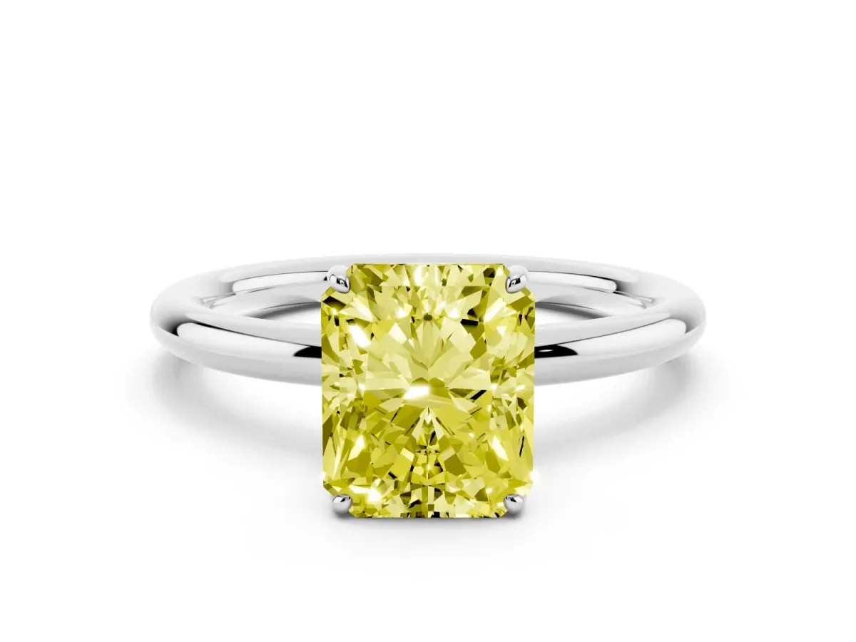 Fancy Yellow Radiant Cut Solitaire Diamond Ring with Four-Prong Setting on a Plain Band Platinum