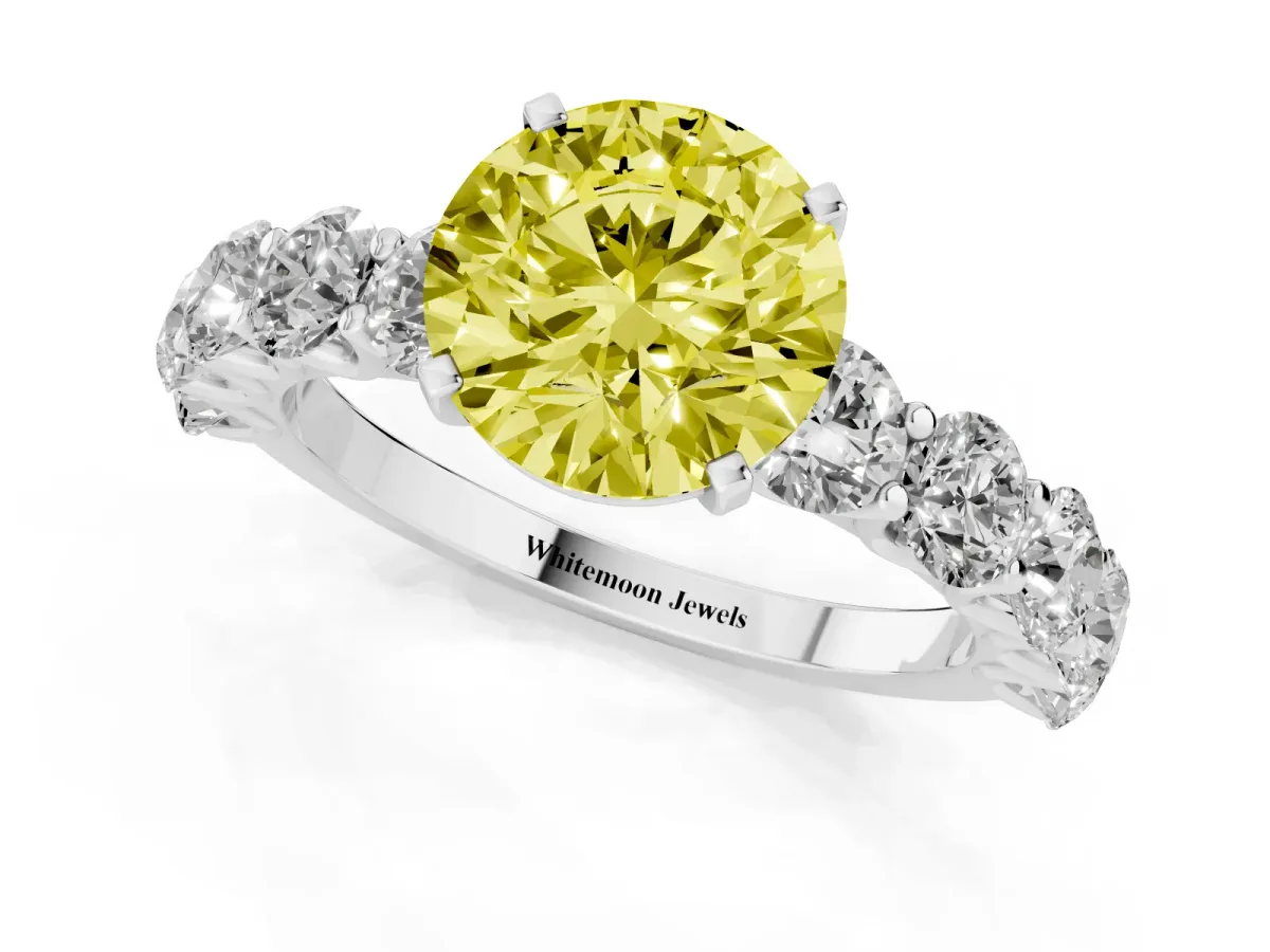 Fancy Yellow Round Cut Diamond Prong Setting with Side Stones on a Pave Band Platinum