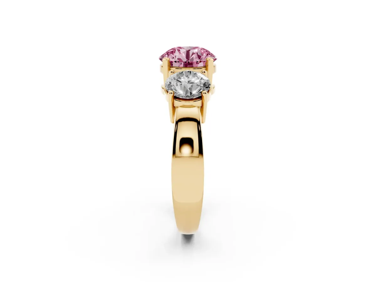Fancy Pink Three-Stone Round Cut Diamond Ring with Round Side Stones, Classic Band, and Four-Prong Setting Yellow gold