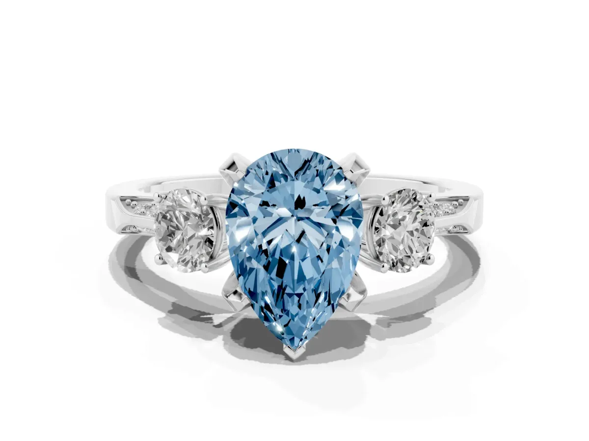 Fancy Blue Pear Cut Brilliant Three-Stone Diamond Ring with Pavé Band and Four-Prong Setting Silver