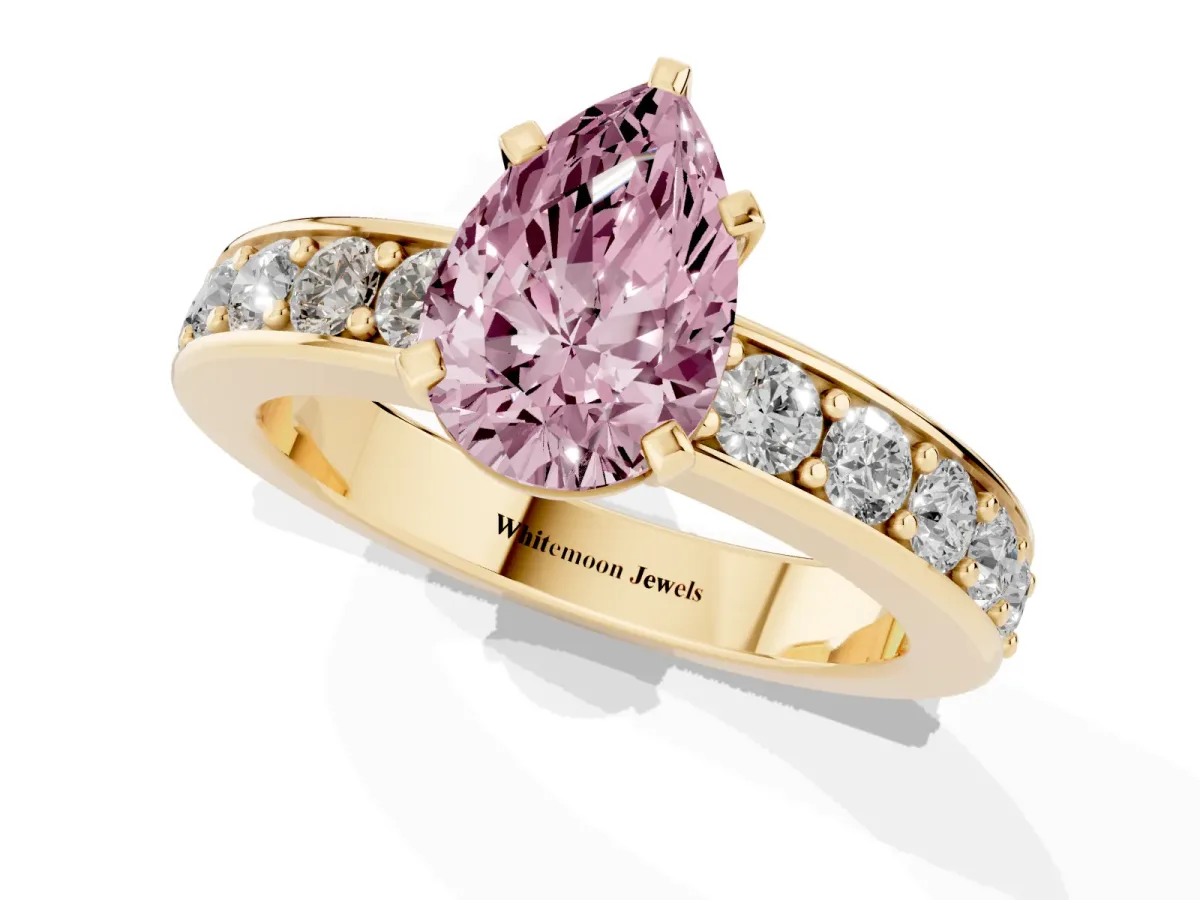 Fancy Pink Pear Cut Diamond Engagement Ring with Channel Set Round Band and Prong Setting Yellow gold