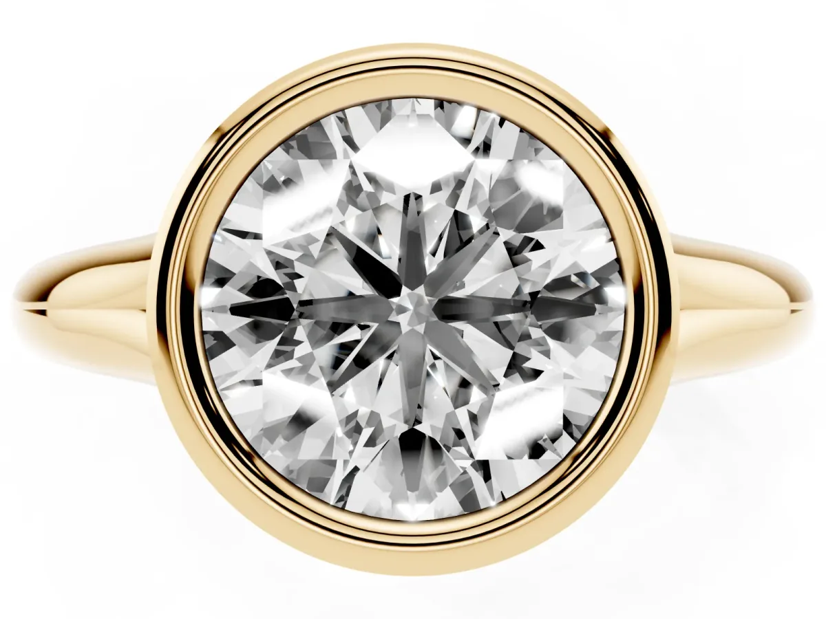Bezel Set Round Cut Solitaire Diamond Ring with Smooth Band Yellow gold