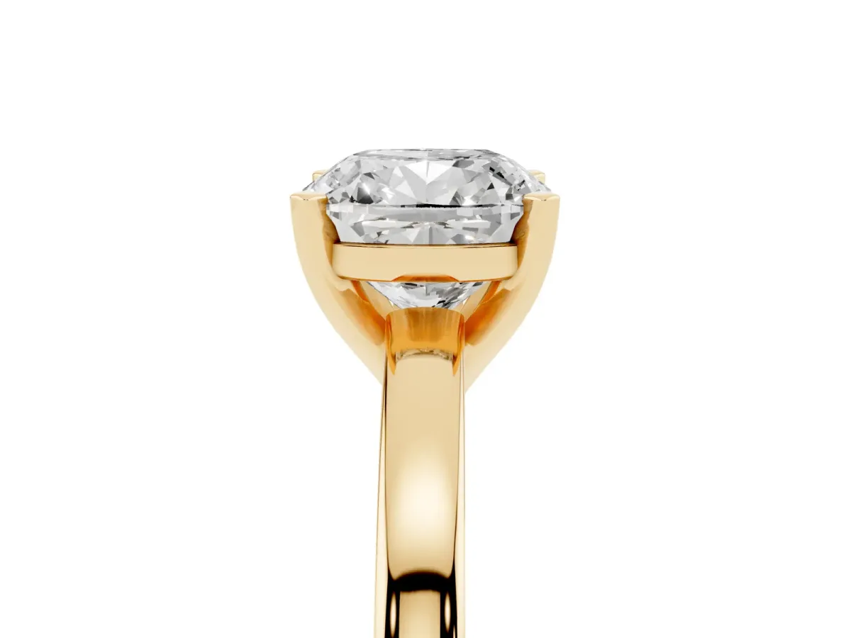 Cushion Cut Solitaire Diamond Engagement Ring with Four-Prong Setting on a Classic Band Yellow gold