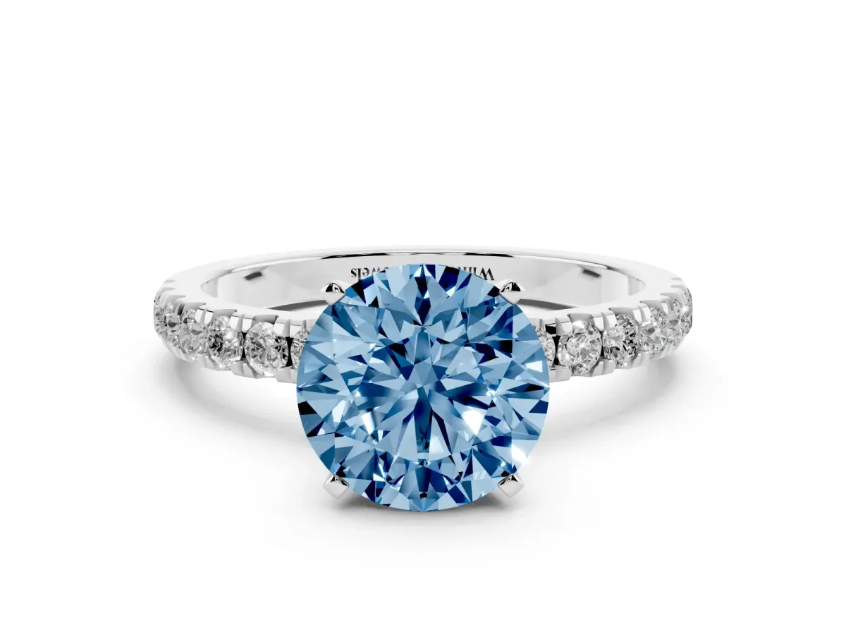 Fancy Blue Round Cut Diamond Solitaire Ring with Pavé Accents and Four-Prong Setting Platinum