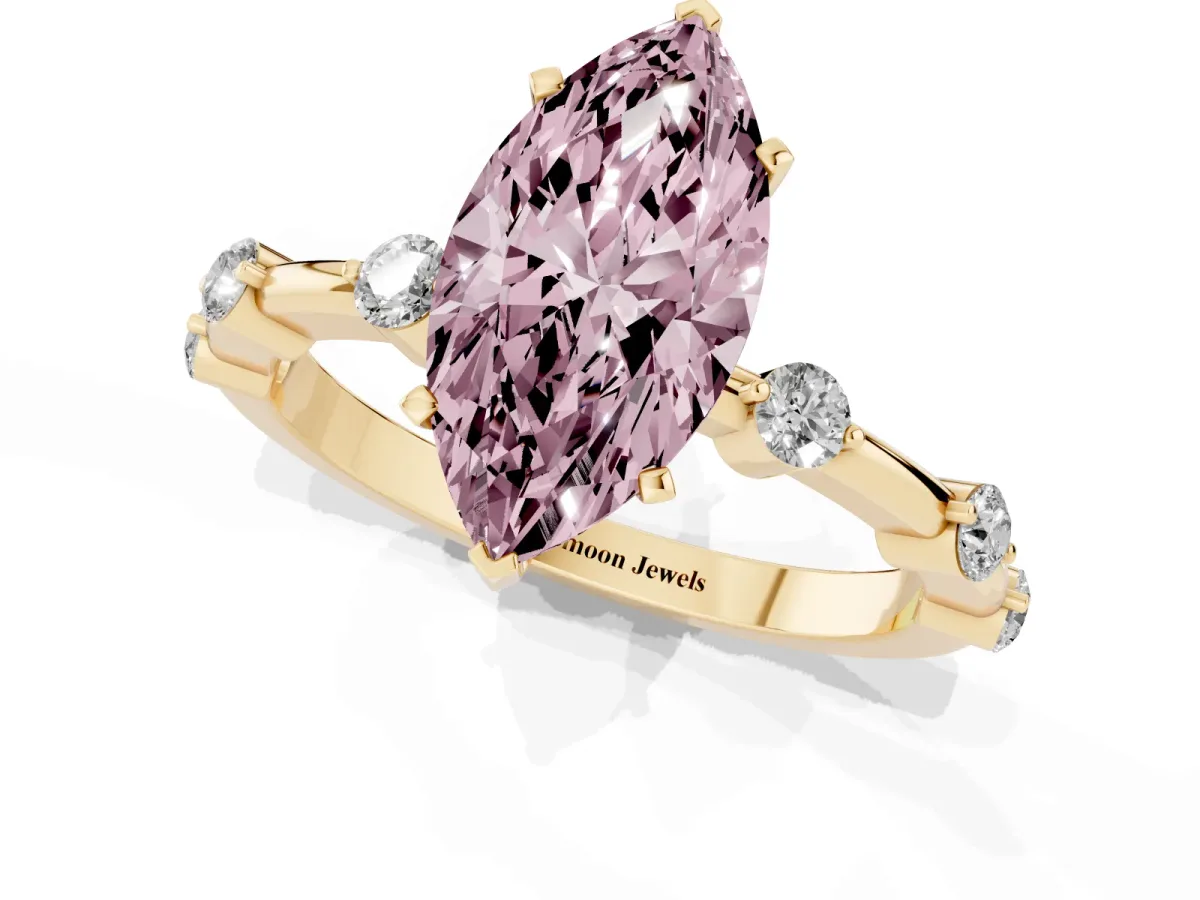 Fancy Pink Marquise Cut Solitaire Diamond Ring with Bezel Set Side Stones and Prong Setting Yellow gold