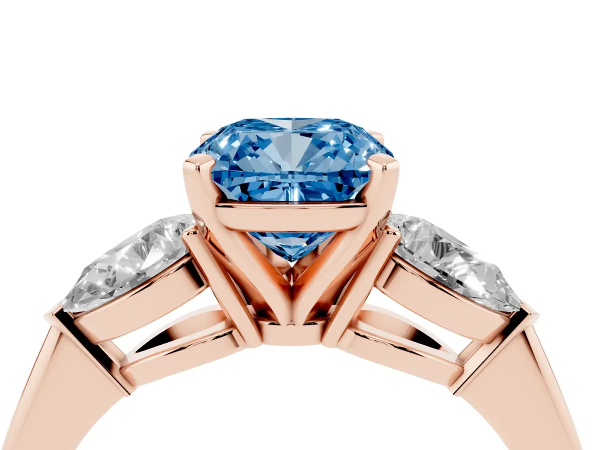 Fancy Blue Three-Stone Cushion Cut Diamond Ring with Pear Side Stones and Four-Prong Setting Rose gold
