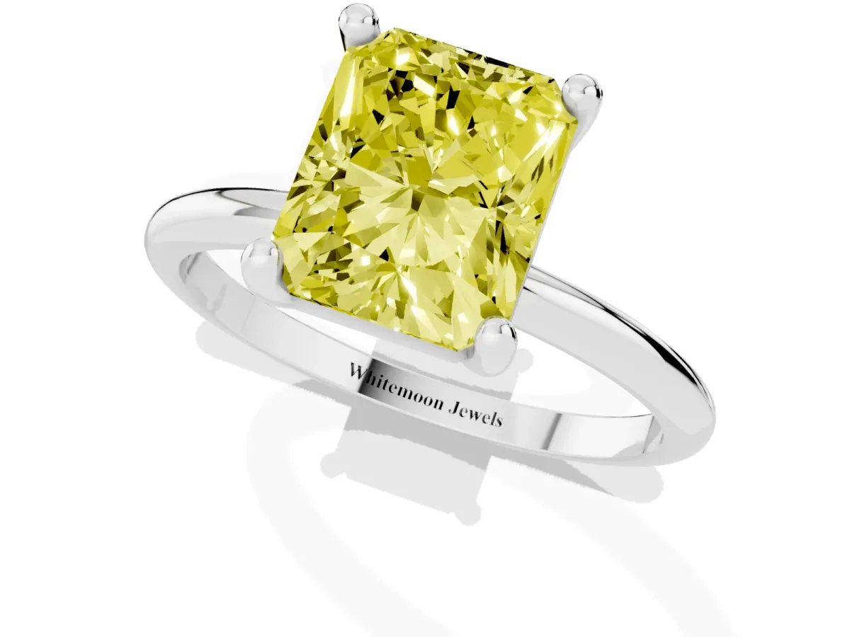 Fancy Yellow Radiant Cut Solitaire Diamond Ring with 4-Prong Setting on a Classic Band Platinum