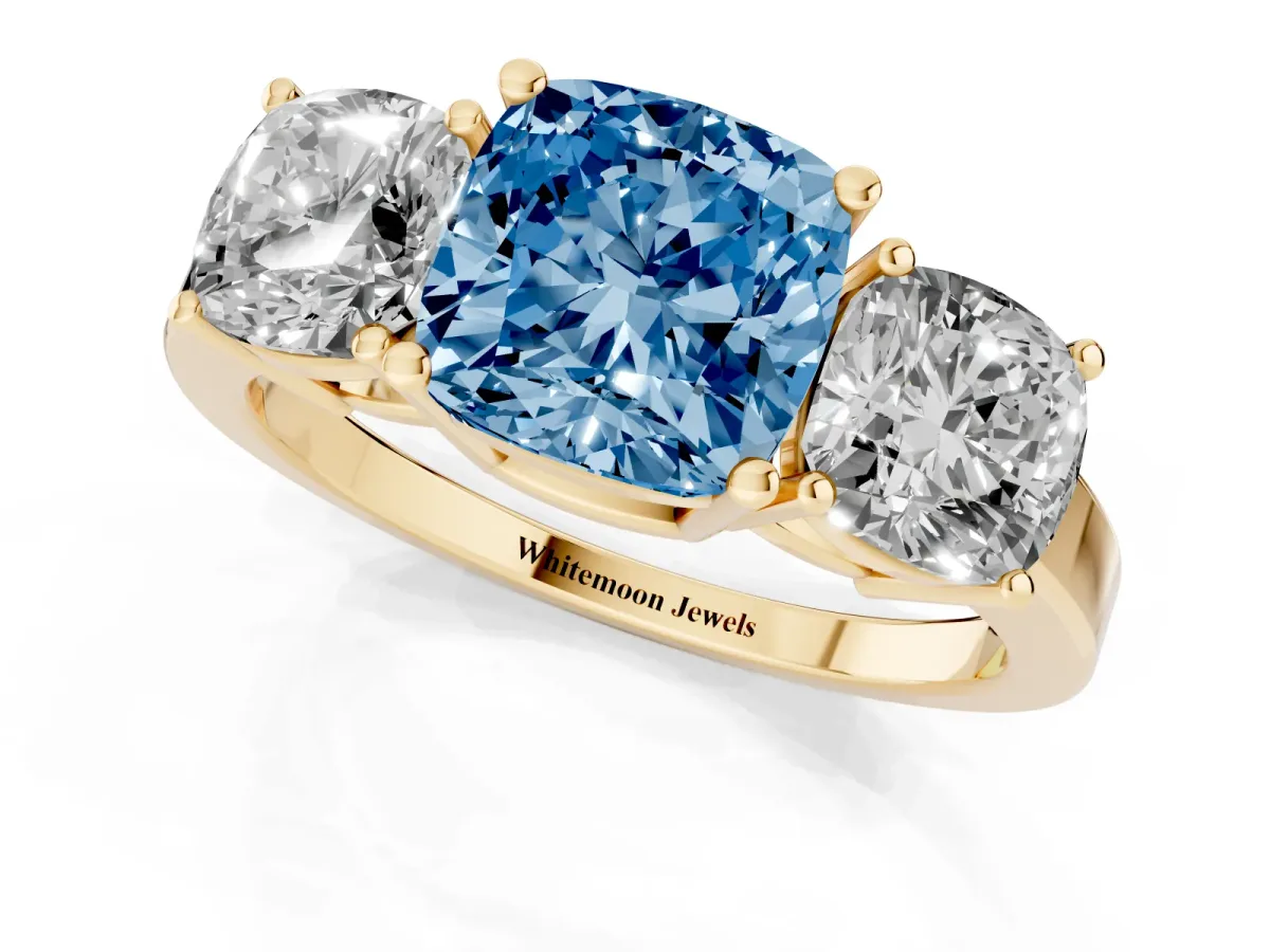 Fancy Blue Three-Stone Cushion Cut Cut Diamond Engagement Ring with Flat Band and Four-Prong Setting Yellow gold