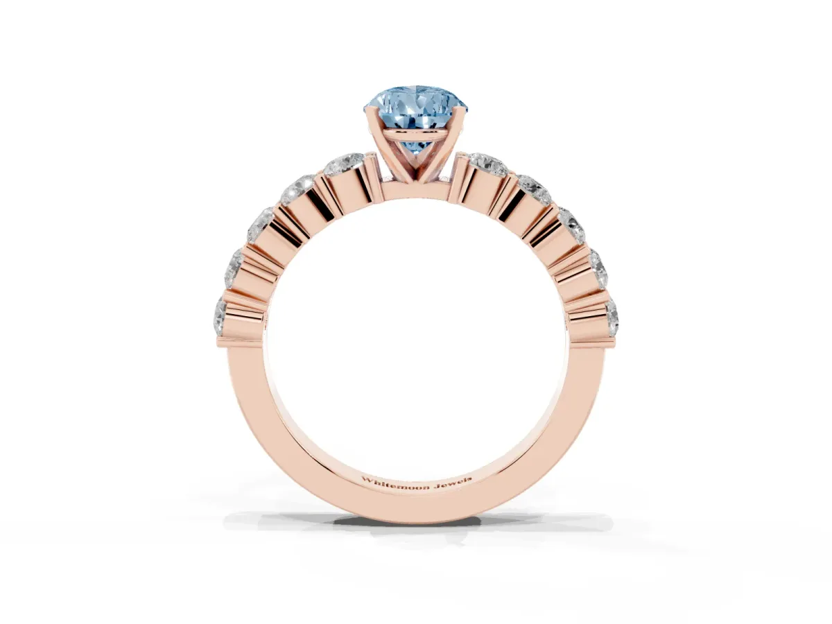 Fancy Blue Pear Cut Diamond Solitaire Ring with Shared Prong Round Side Stones Rose gold