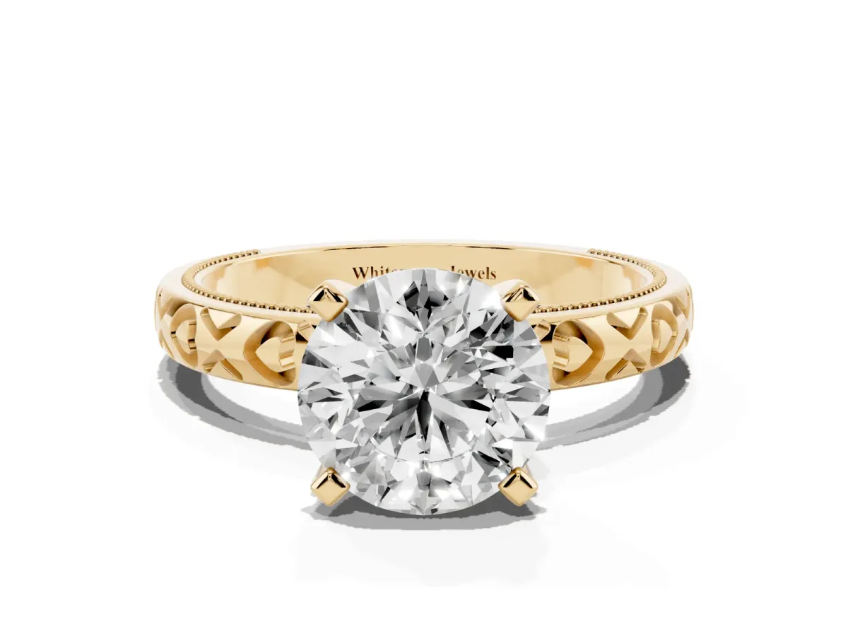 Round Cut Solitaire Diamond Engagement Ring with XO Engraved Band and Four-Prong Setting Yellow gold